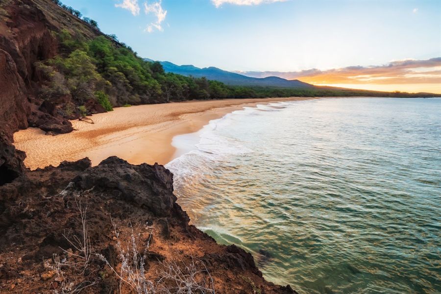 Sunset light on the beach and lava rocks at Makena on south Maui