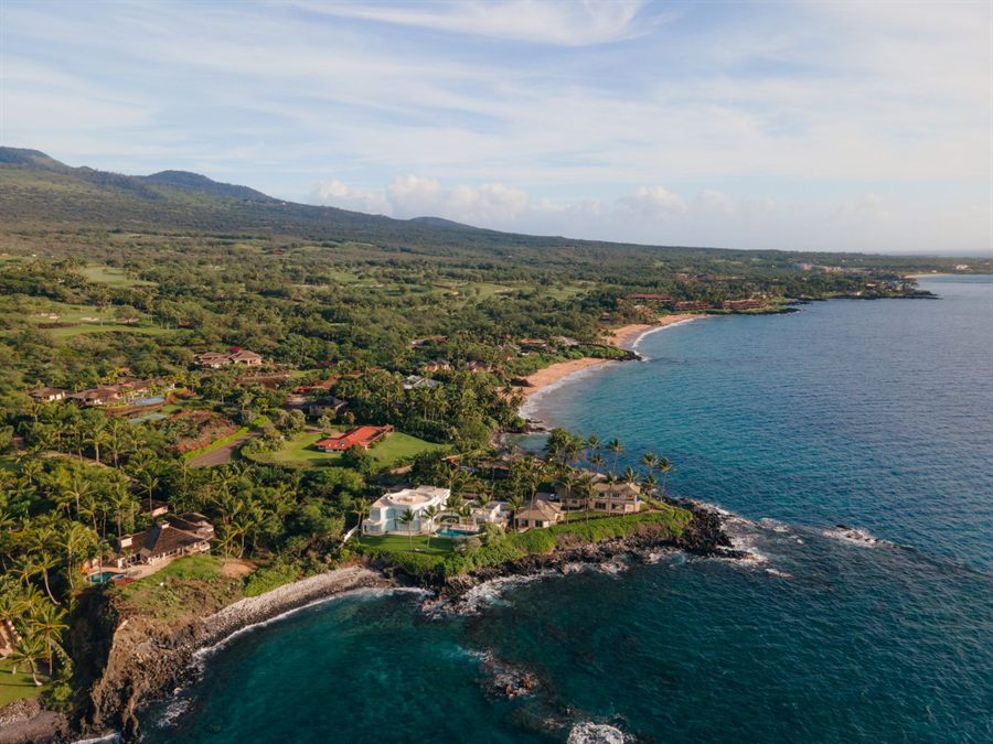 Aerial view of the green Wailea-Makena coastline and calm water on south Maui