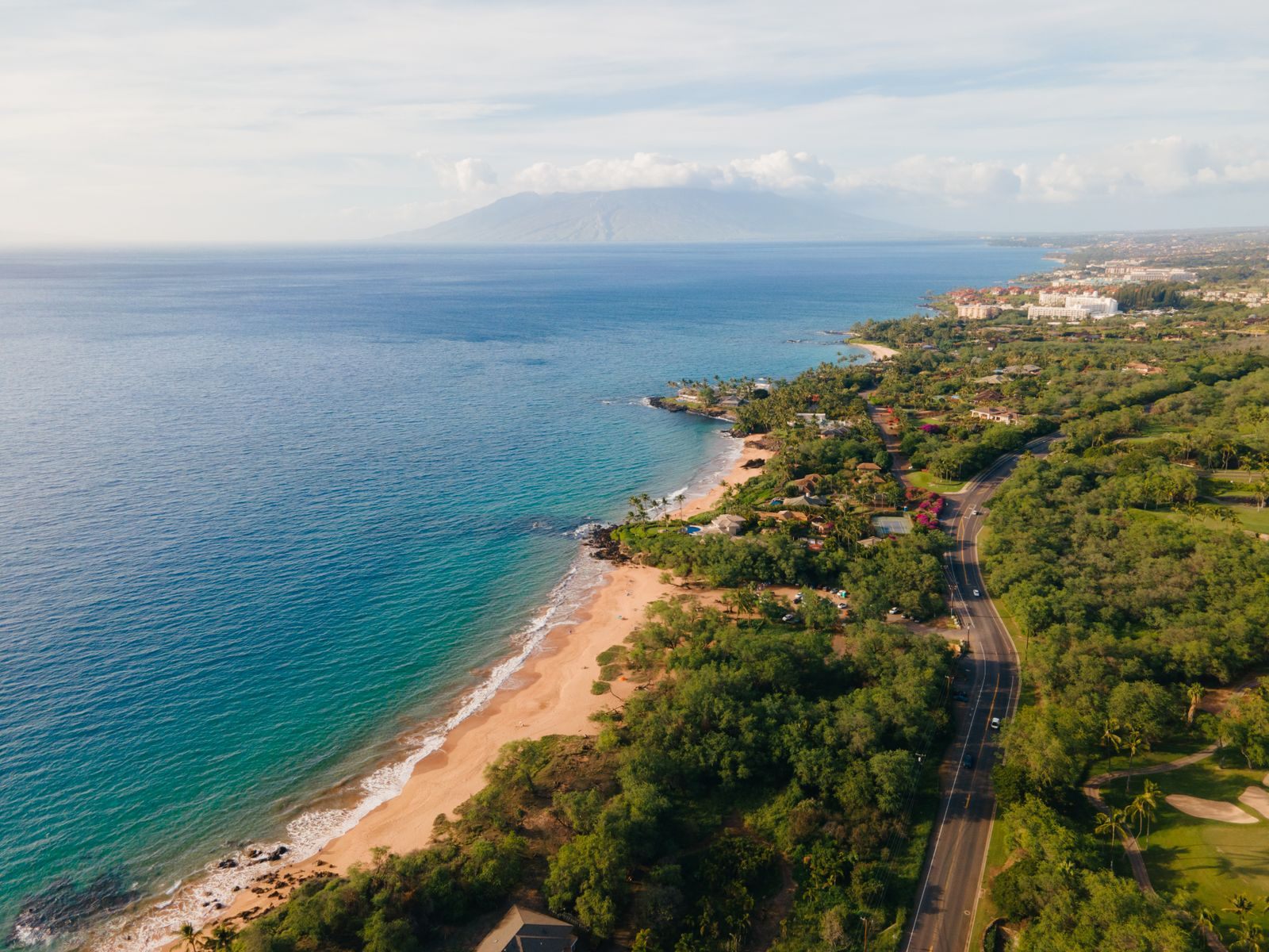 Aerial view of the Kihei coastline on the south shore of Maui with calm ocean